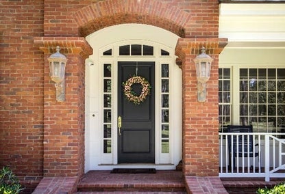 Front door of a brick colonial style home typical of real estate in Firebrook, Lexington, Kentucky